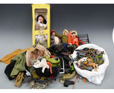 A collection of Action Man figures, clothes and accessories together with a large quantity of model soldiers, cowboys and Ind