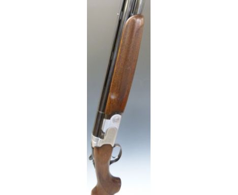 Beretta 686 Special 12 bore over and under ejector shotgun with all over floral engraving, chequered semi-pistol grip and for