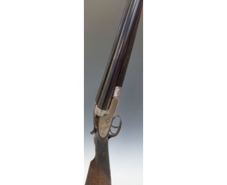 Williams & Powell 12 bore side lock shotgun with named and engraved locks, chequered grip and forend, engraved trigger guard,