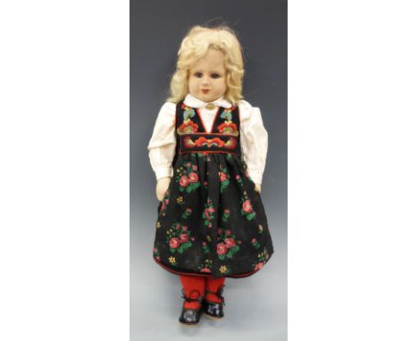 A 1930s felt doll, probably Norah Wellings for Chad Valley, blonde hair with glass eyes, dressed in Tyrolean costume, approxi