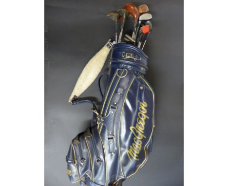 A MacGregor golf bag containing sixteen driver and wedge golf clubs by Wilson, Dunlop, Petron, Ben Hogan etc