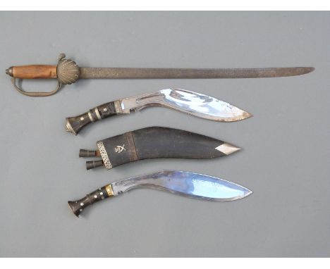 Two kukris, one engraved to blade Darjeeling 1944 J Forst Reme, horn handle, blade length 33cm, the other with horn handle in