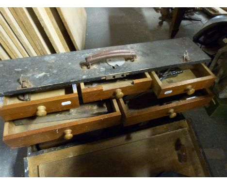 A vintage fitted tool chest containing various planes and other woodworking tools 