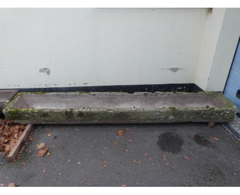 A rectangular carved natural stone trough (L284 x W47 x H22cm)