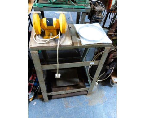 A workshop stand with bench grinder and two surface plates 