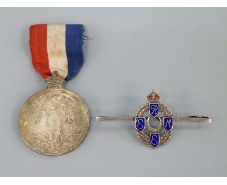 A silver REME sweetheart brooch set with blue enamel and a medal for the Imperial Choir Founded 1910 