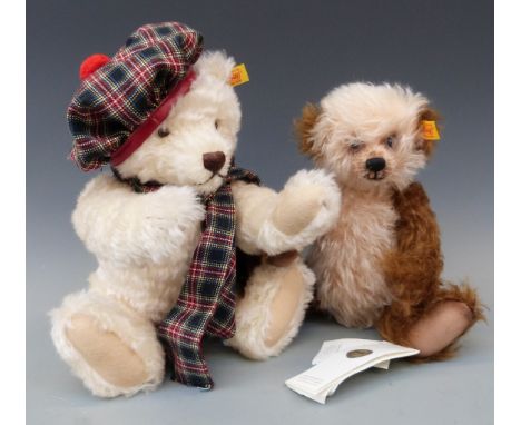Two Steiff Teddy bears one with coffee and cream mohair, shaved snout and jointed limbs, 30cm tall, the other with cream moha