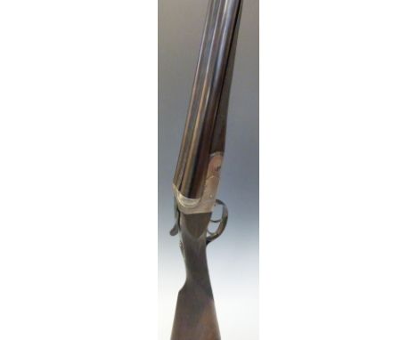 BSA 12 bore side by side ejector shotgun with named lock, chequered grip and horn tipped forend, double trigger, vacant carto