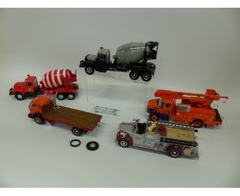 Five First Gear diecast model American construction and commercial vehicles including cement mixers, fire engine, cherry pick