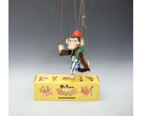Pelham Puppets Display Range monkey with brown moulded head, red felt fez and green waistcoat, yellow and brown multicoloured