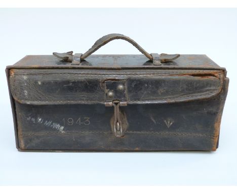 A military motorcycle tool box with embossed date 1943 and ministry arrow, 27 x 9 x 12cm