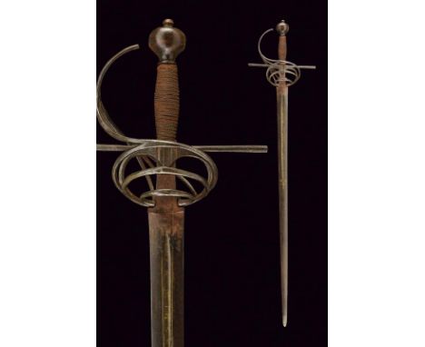 dating: 19th Century provenance: Europe, Wide, straight, double-edged blade with central groove, with inscription and remains