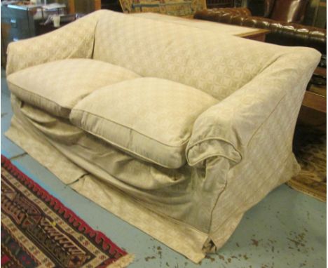 SOFA, calico with a loose gold patterned cover on short square tapered supports with castors, 191cm L x 84cm H. (with faults)