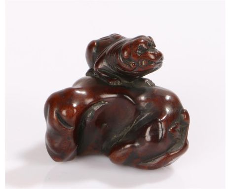 Japanese Edo period netsuke, 18th Century, Shishi on a rock, 3.5cm high