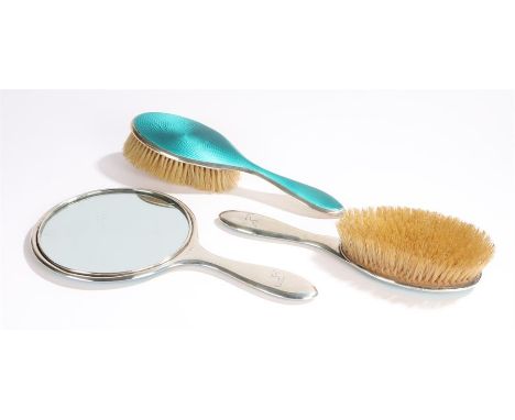George V silver guilloche enamel vanity set, Birmingham 1922 to include the mirror and two brushes with turquoise enamel, (3)