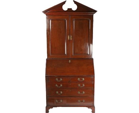 George III mahogany bureau bookcase, the swan neck pediment above a pair of panel doors enclosing shelves above a sloping fal