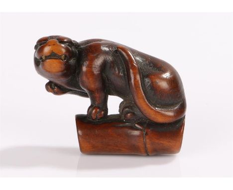 Fine Japanese Edo period boxwood netsuke, 18th Century, Tiger on bamboo, 4.5cm long