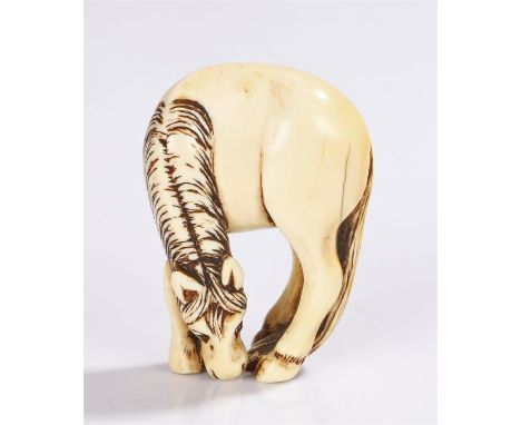 Japanese Edo period ivory netsuke, 18th Century, grazing horse, 6cm high