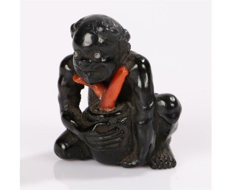 Japanese Meiji period netsuke, the two colour coral netsuke carved as a native coral fisher. 3.5cm high