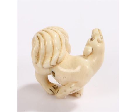 Japanese Meiji period ivory netsuke, carved as a dog with an arched neck and bushy tail 4cm long 