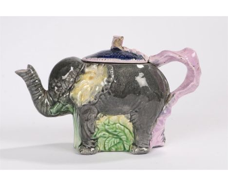 Majolica elephant teapot, the blue basket weave lid with puce tied ribbon handle and finial, 14cm high