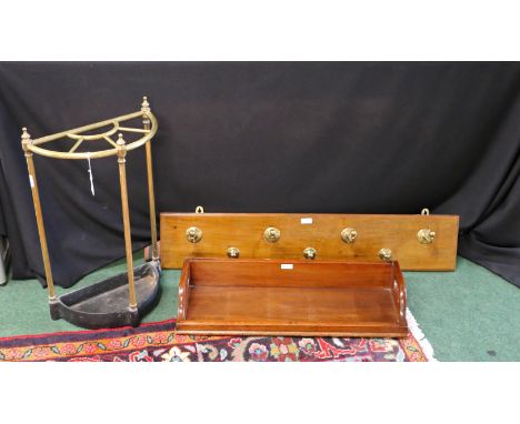 Victorian brass stick stand, with a bow front and five divides on an iron base, together with an Edwardian coat rack and a Vi