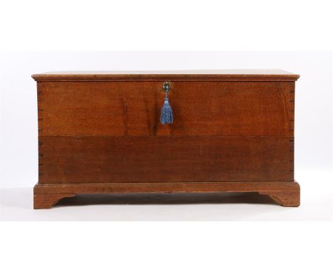 19th Century oak blanket box, the rectangular top enclosing storage space raised on bracket feet