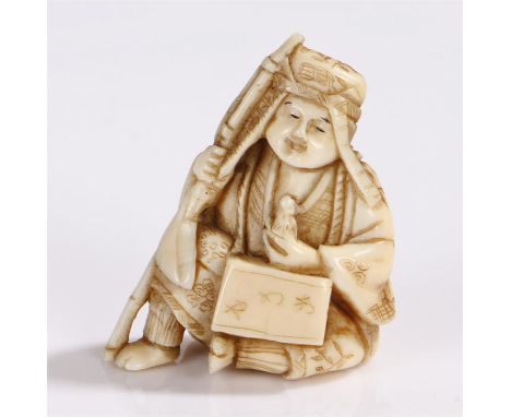 Japanese Meiji period ivory netsuke, carved as a rat catcher, with a rat to his hand and a stick, 4cm high