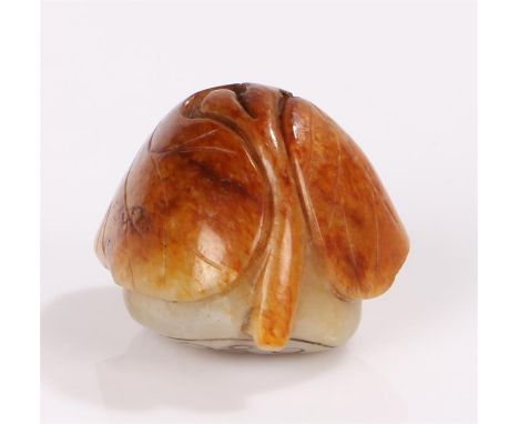 Japanese Meiji period jade carving, the two colours of jade carved as a lotus leaf over a lotus pod. 2.5cm high