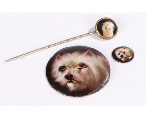 Gold coloured metal tie pin, set with a miniature circular enamel panel depicting a terrier dog in the style of William Essex