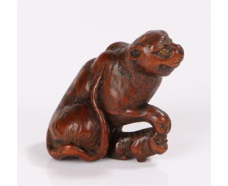Japanese Edo period boxwood netsuke, the netsuke carved as a tiger and cub, signature to the base 4.5cm high