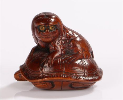 Japanese Edo period netsuke, 18th Century, carved with a kappa rested on a terrapin, 5cm long