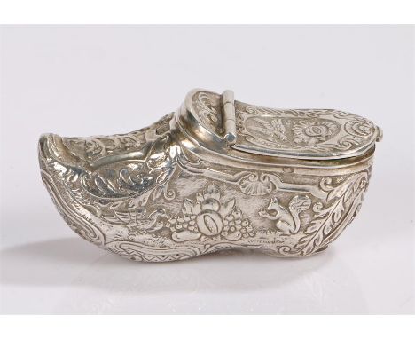 Dutch silver snuff box in the form of a clog, the hinged cover with bird and scroll decoration, the clog form base with depic