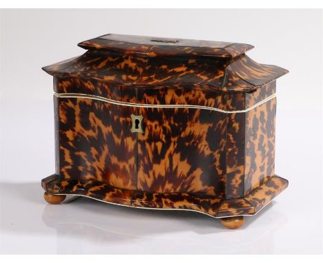 Regency serpentine fronted tortoiseshell tea caddy, the shaped stepped top enclosing two lidded compartments above a serpenti