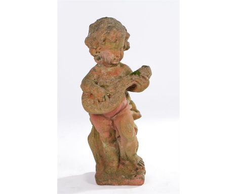 Terracotta garden statue, of a boy playing an instrument on a plinth base, 54cm high