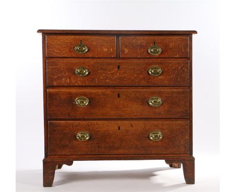 19th century oak chest of two short and three long drawers, with oval brass back plates to the handles, on bracket feet, 96.5