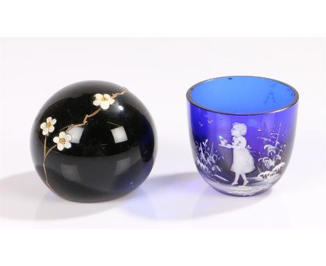 Victorian Mary Gregory blue cup with white decoration of a girl carrying a cup and saucer and a dark green glass paperweight 