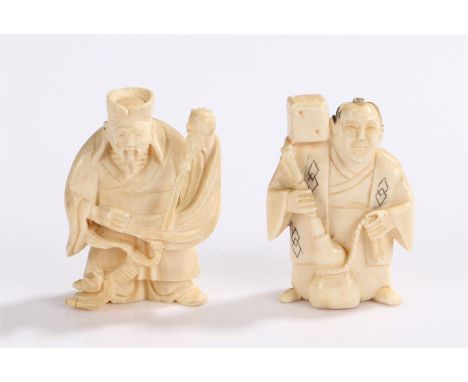 Two early 20th Century Japanese ivory netsuke, the first carved as an elderly gentleman with a cat, signed to the base, the s