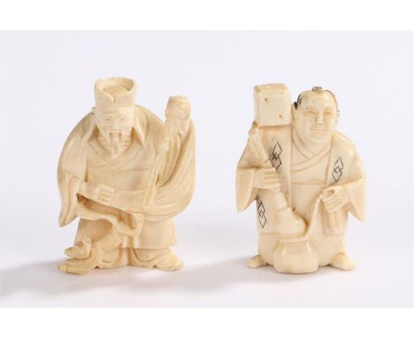 Two early 20th Century Japanese ivory netsuke, the first carved as an elderly gentleman with a cat, signed to the base, the s