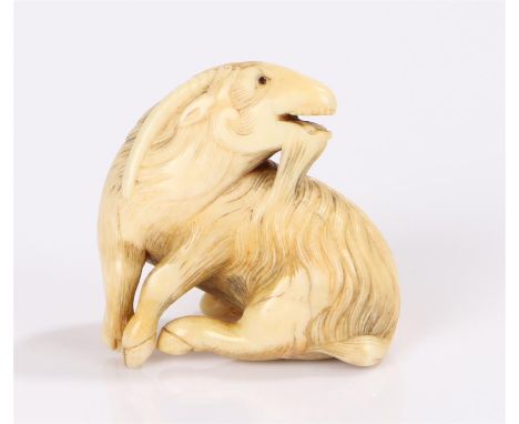 Japanese Edo period netsuke, the ivory netsuke carved as a Kyoto goat, seated and looking to the rear signature to the base,4