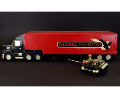 A Vintage Large Model Articulated Remote Controlled ' Battery ' Required Global Transport Long Haulage Truck - Red and Black 