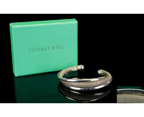 Tiffany & Co Sterling Silver Bangle. Marked Tiffany & Co. 925. Complete with Tiffany & Co Box. Excellent Condition. 