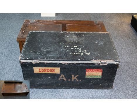 Antique Travel Trunk And Associated Wood Panel Trunk Large black trunk circa early 20th century, hinged lid, aged patina and 