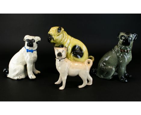 A Collection Of Antique Ceramic Pug Figurines Four in total to include 19th century Staffordshire pug (some areas of restorat