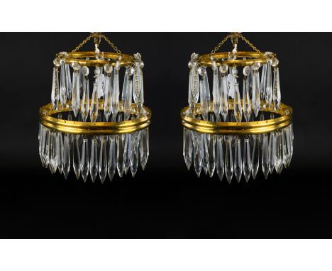 A Pair Of Vintage Brass And Crystal Light Fittings Two in total, each formed of concentric bass circles profusely ornamented 