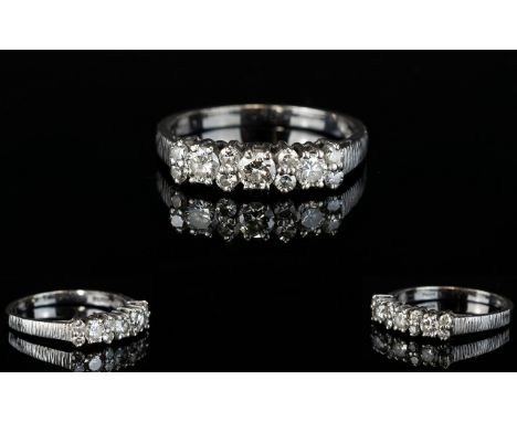 18ct White Gold Channel Set Diamond Dress Ring. The 3 Larger Round Brilliant Cut Diamonds with 8 Diamond Spacers. All of Good