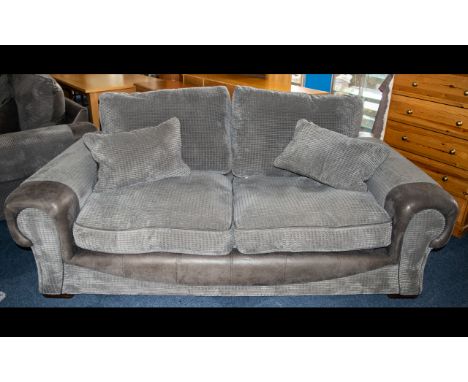 A Large Contemporary Two Seater Sofa Complete with matching scatter cushions, very large sofa with plush slate grey textured 