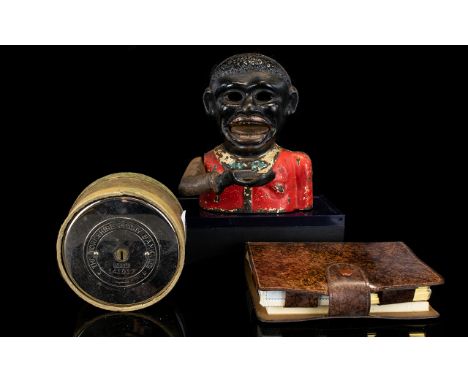 A Novelty Cast Iron Money Box Antique money box in cold painted cast metal. Along with vintage boxed stainless steel 'Yorkshi