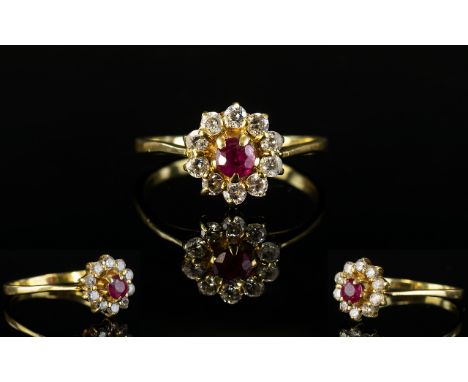 18ct Gold Ruby and CZ Set Cluster Ring. Flower head Setting. The Central Ruby Surrounded by 10 Diamonds. Ring Size - M. Excel