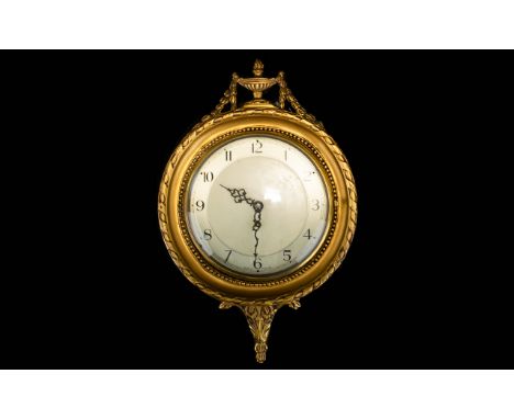 Early 20th Century Neoclassical Style Wall Clock Circular clock with cream dial and black figuring in yellow gilt frame with 